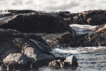 Close up of waves crashing on a rocky shore