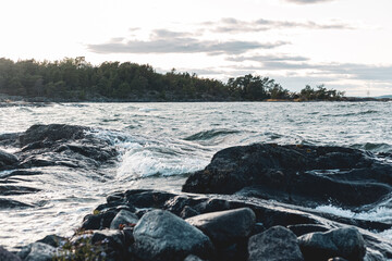 Close up of waves crashing on a rocky shore