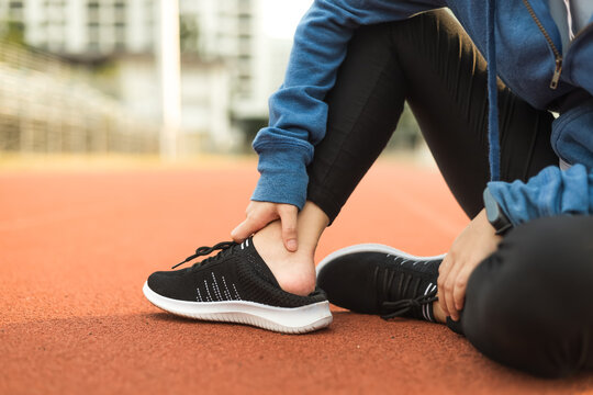 Sport shoes hurt feet after running on track race.
