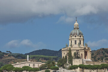 Fototapeta na wymiar The dome of Church of King (Cristo Re) overlooking the city of Messina in Italy during summer. Beautiful photo of the landmark in Sicily
