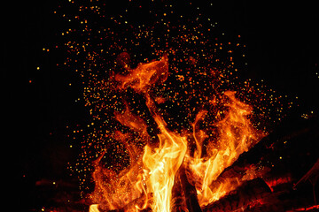Night bonfire with close-up sparks. Fire overlay for Photoshop with sparks and open flames. Bright...