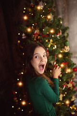 joyful and cheerful young girl on a festive winter evening