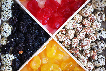 Nuts and dried fruits assortment on stone table top view.