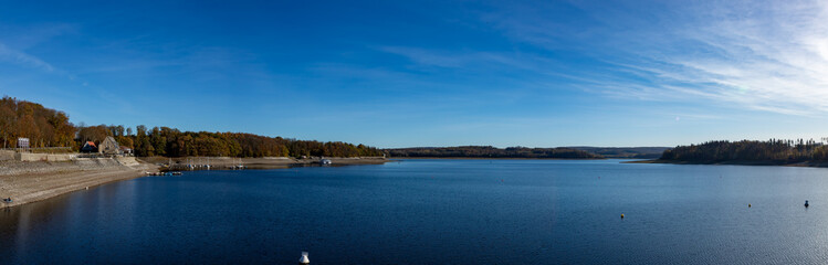 Fototapeta na wymiar Panorama view of lake at Moehnetalsperre, water reservoir, in Sauerland region, Germany