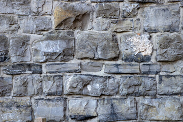 gray brown quarry stone wall as background