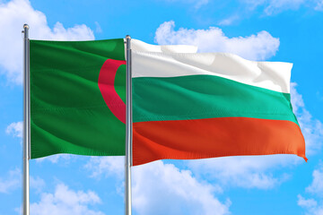 Bulgaria and Algeria national flag waving in the windy deep blue sky. Diplomacy and international relations concept.