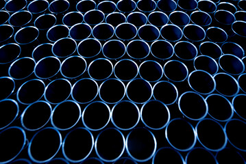 Abstract background of steel pipes stacked on a pallet