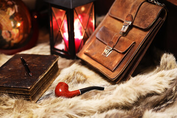 Retro old book and world desk globe on fur, learning and education concepts.