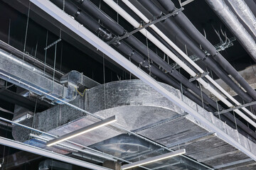ceiling of an industrial building with various technical structures