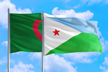 Djibouti and Algeria national flag waving in the windy deep blue sky. Diplomacy and international...