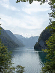 Berchtesgaden lake K&ouml;nigssee with trees in foreground and mountains in the background