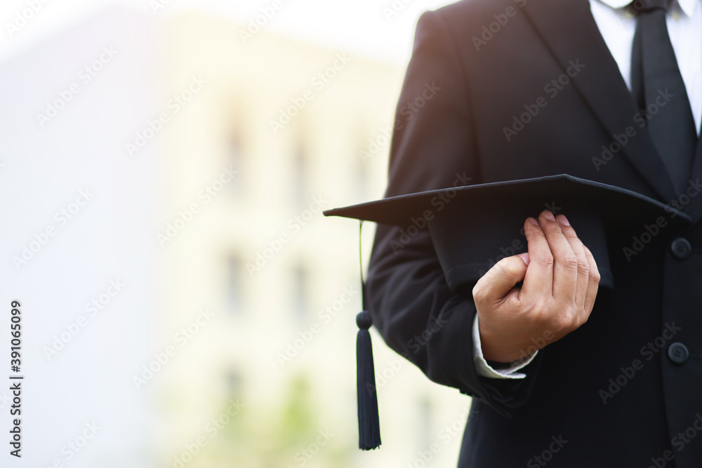 Wall mural graduates of the university, businessman holding hats along with success, filter tone outdoor sunny  - Wall murals