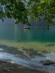 Berchtesgaden lake K&ouml;nigssee with trees in foreground and mountains in the background