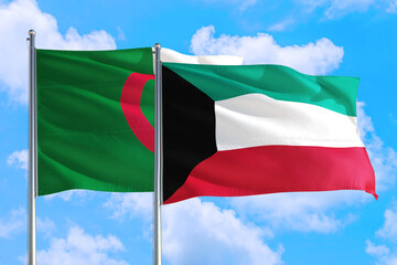 Kuwait and Algeria national flag waving in the windy deep blue sky. Diplomacy and international...