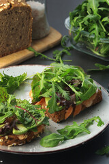 Sandwiches with salmon, avocado and salad