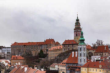 Fototapeta na wymiar Beautiful view of Český Krumlov castle and the castle tower with St. Jost church in old town of Cesky Krumlov on a cloudy day, Czech Republic