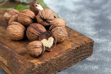 Walnuts. Contains beneficial vitamins and minerals. On a gray background.