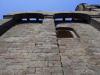 Fortified Cathedral of Agde. Detail of wall and machicolations in the top. (12 century). Occitanie....