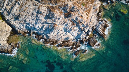 Aerial top view of sea waves break on a beach. drone shot Greece