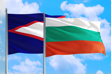 Bulgaria and American Samoa national flag waving in the windy deep blue sky. Diplomacy and international relations concept.