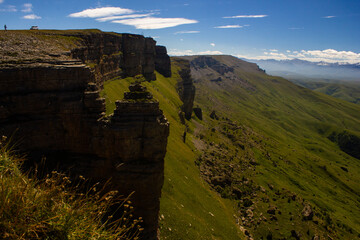 A beautiful gorge in the Caucasus Mountains. Blue sky and huge rocks. Bermamyt plateau