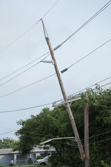 A utility pole broken by storm damage after a hurricane swept through the Cayman Islands