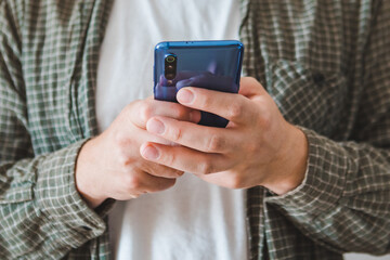 smiling man portrait using phone