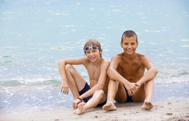 Cheerful boys on the beach