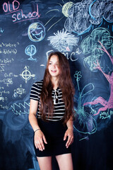 young cute teenage girl in classroom at blackboard cheerful smiling, lifestyle modern people concept