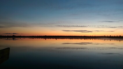 Obraz premium sunset over the river