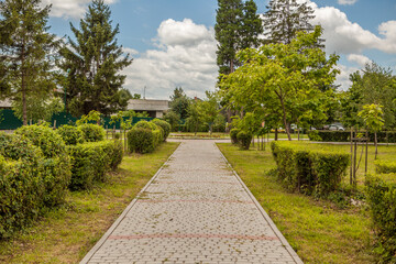 Fototapeta premium Stone lined path in the park