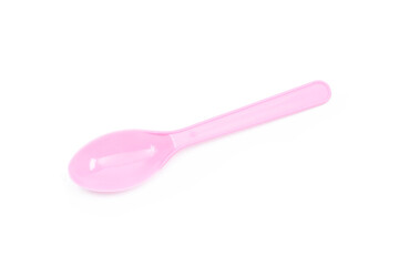 Pink plastic spoon isolated on white background.