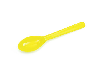 Yellow plastic spoon isolated on white background.