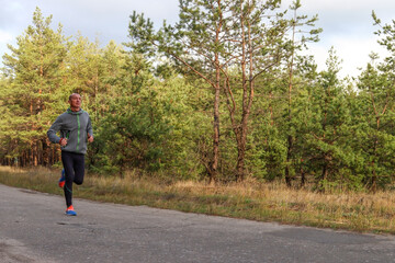 Man running on the road, marathon training, sports, outdoor fitness