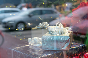 Photo through glass. Shop window, decorations and New Year's gifts.