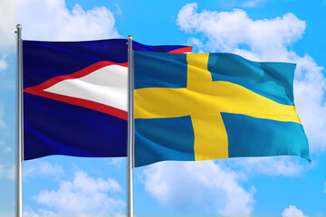 Sweden and American Samoa national flag waving in the windy deep blue sky. Diplomacy and international relations concept.