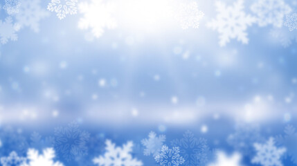 Wide blurred winter background. The sun is shining in snowflakes. Abstract blue Christmas background. Panorama.