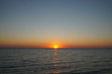 Rising sun over the sea. Early morning.