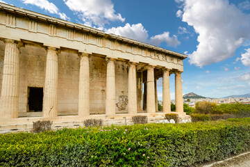 The Temple of Hephaestus or Hephaisteion with Lykavittos Hill in the background in Athens, Greece