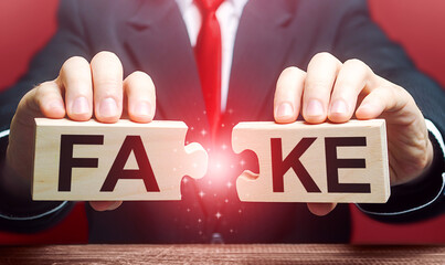 A man breaks a fake puzzle. Exposing fake news and false info. Debunking myths. Investigation of...