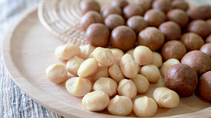 Organic Macadamia nut. macadamia nuts are cracked and baked to taste extremely delicious superfood fresh natural shelled unsalted raw macadamia and healthy food concept