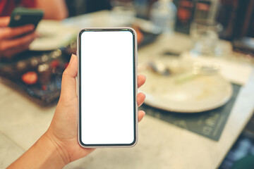 Women's hands holding cell telephone blank copy space screen. smartphone with blank white screen isolated on white background . smart phone with technology concept