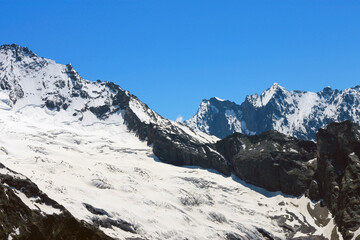 Caucasus Mountains Under Snow And Clear Blue Sky