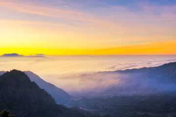 Naklejka na ściany i meble Beautiful sunrise over sea of fog at Mount Bromo in Bromo Tengger Semeru National Park, East Java, Indonesia