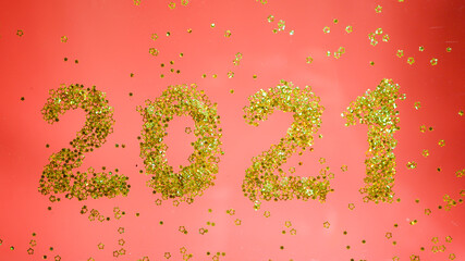 2021 numbers. Golden glitters. Red background. New Year wallpaper