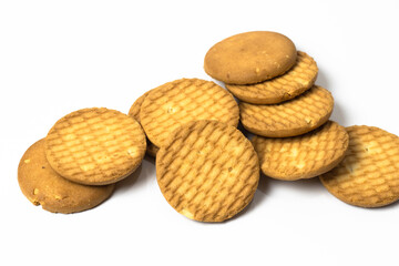Scattered wheat crispy biscuits isolated on white background