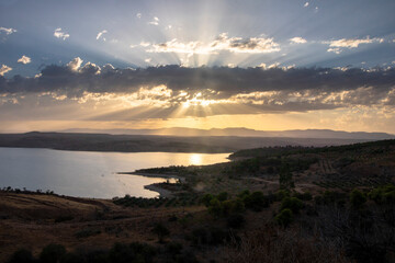 Fototapeta na wymiar beautiful Sunrise in tlemcen algeria Sunrise with clouds and trees in the river