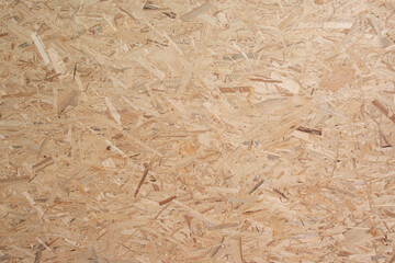 Plank made from wood chips and sawdust for industrial use or as a raw material for furniture.