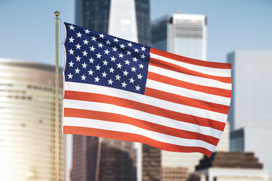 USA flag on blurry skyscrapers background