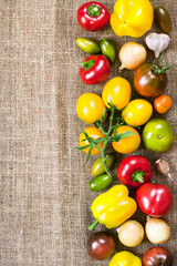 Assortment of colorful fresh vegetables on sackcloth background